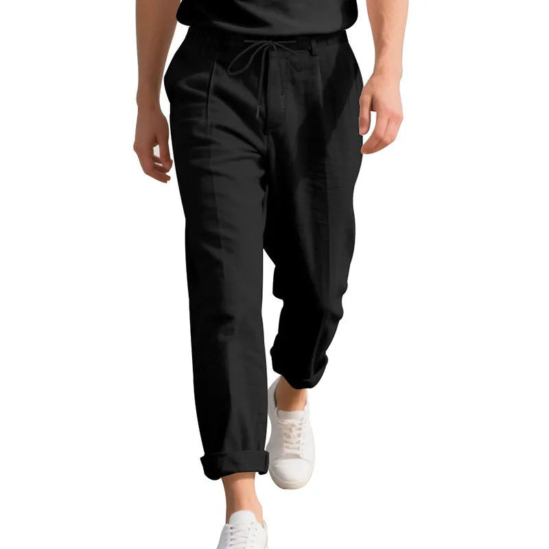 Men's straight-leg linen trousers in light khaki with a drawstring waistband.
