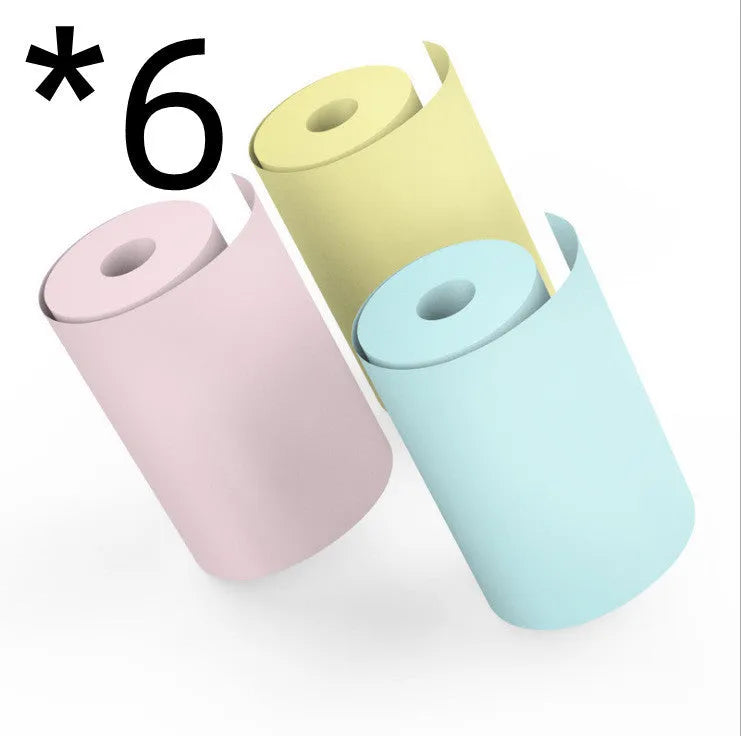 Bluetooth mobile mini thermal printer in pink with paper rolls and USB cable