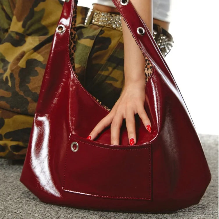 Red leopard print women's shoulder bag with two sides and a dumpling shape.