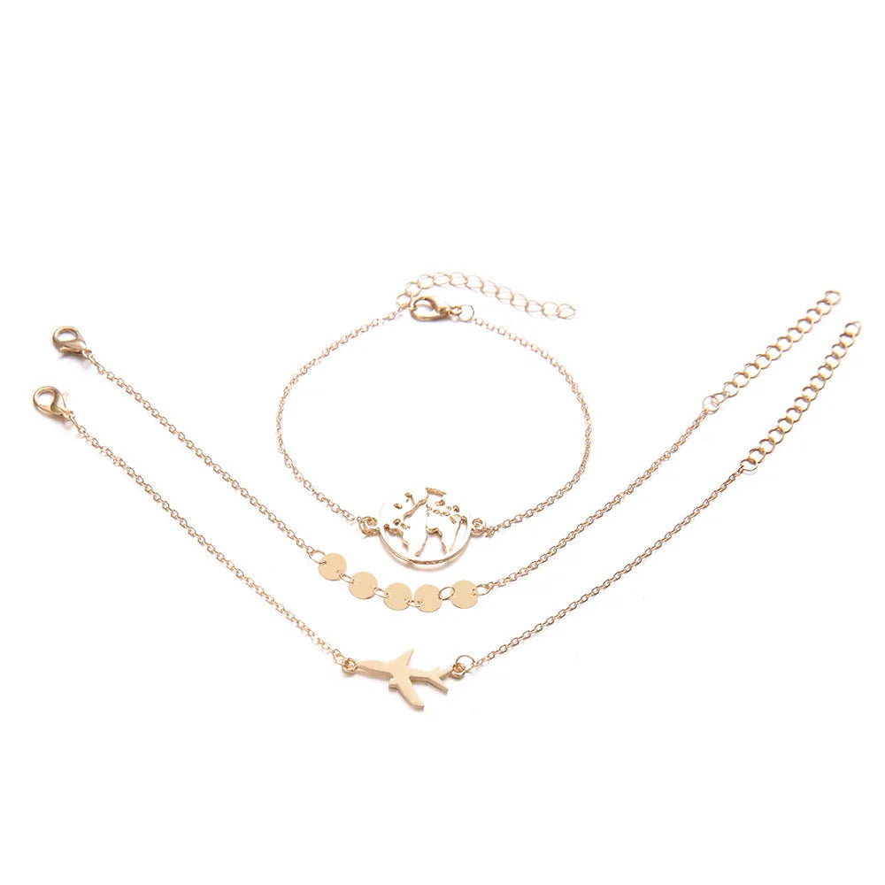 Three bohemian bracelets with heart-shaped aircraft map charms in alloy construction