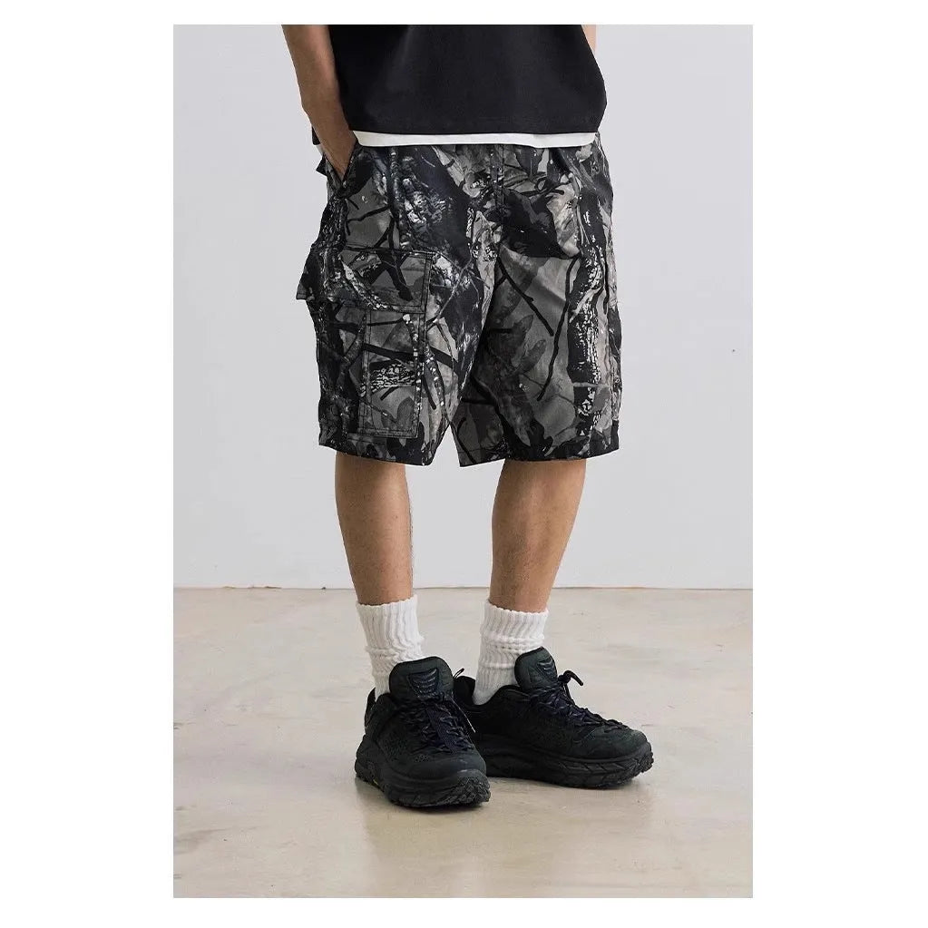 Loose casual straight-leg denim shorts in black on a hanger, showing mid waist and zip fly.
