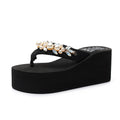 Women's high-heeled flip-flop in beige with a cotton cloth upper.