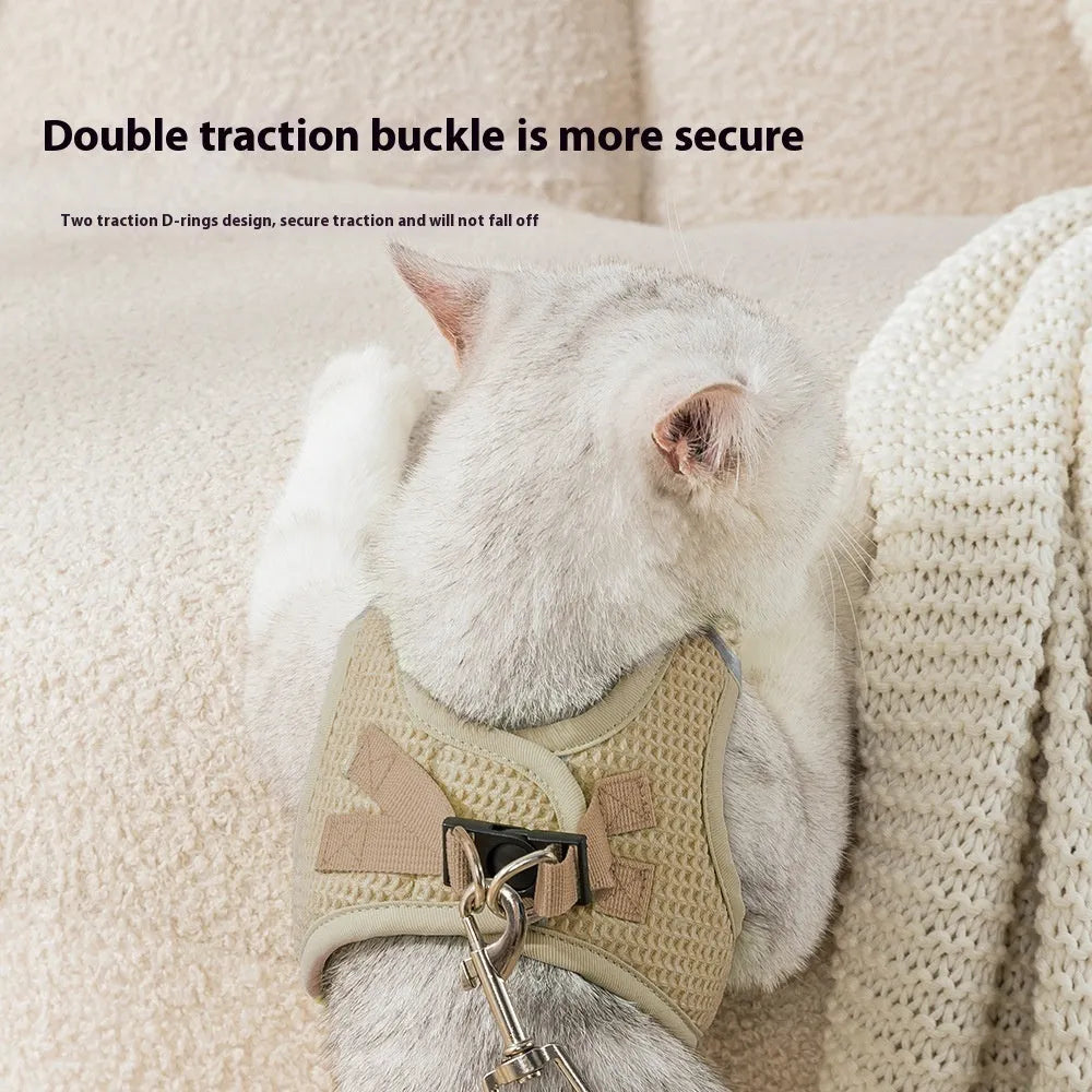 Brown cloth cat harness with waffle-textured pulling rope and adjustable chest strap