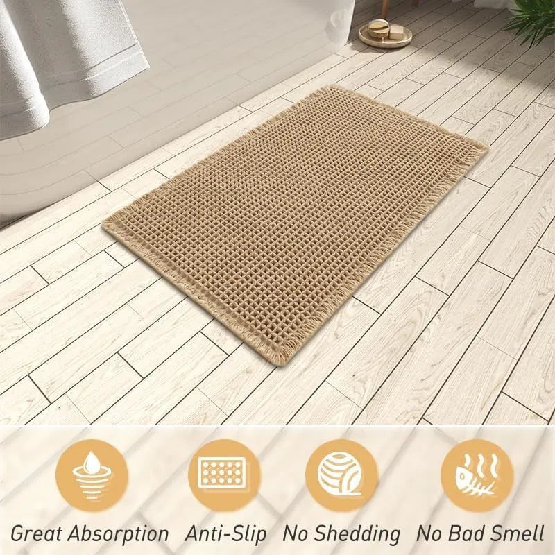 Beige checkered non-slip bathroom carpet mat on tiled floor.