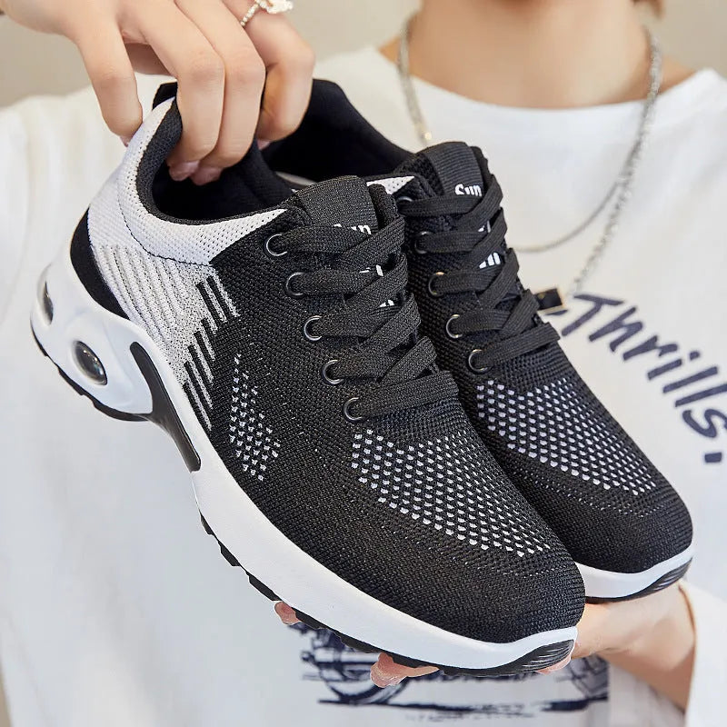 Women's striped flyknit casual running shoes in pink with flat PVC sole and lace-up front