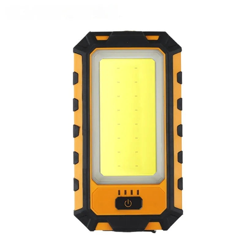Multifunctional work light with magnetic base, dual COB and headlight modes, compact black unit