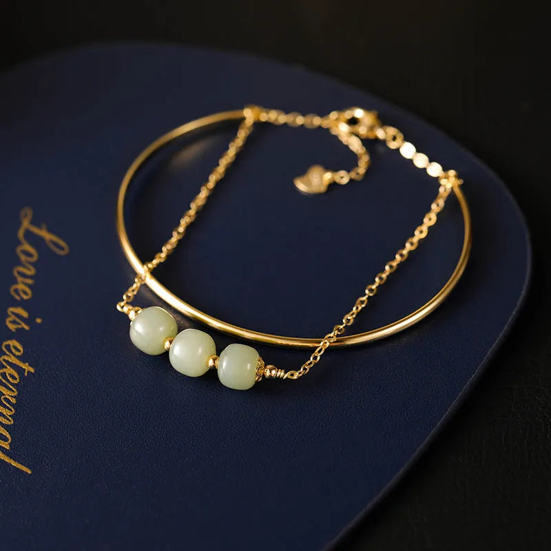 Hetian jade women's bracelet with gold inlay, shown in single, double, and three bead versions.