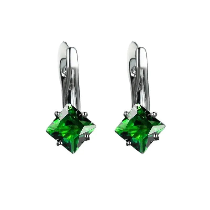 Women's copper earrings with diamond design and inlaid blue zircon stone.