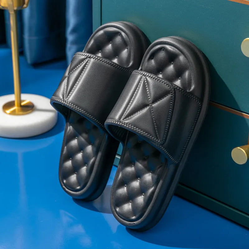 Pair of soft EVA bathroom slippers with a thick non-slip sole, shown in a choice of colours.