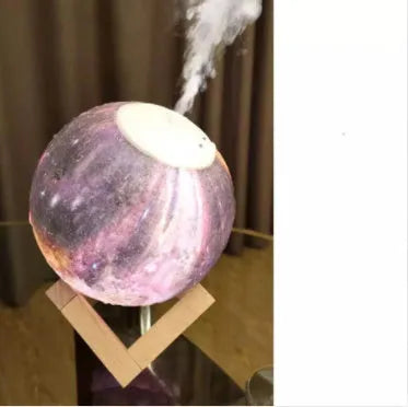 Wood finish Lunar humidifier night light with spherical design on a table.