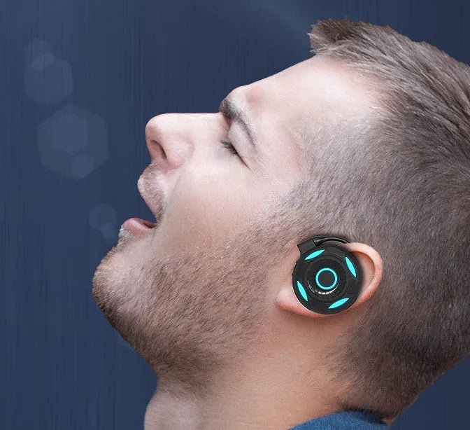 Black and white wireless Bluetooth gaming earphones with hanging ear design and USB connectivity