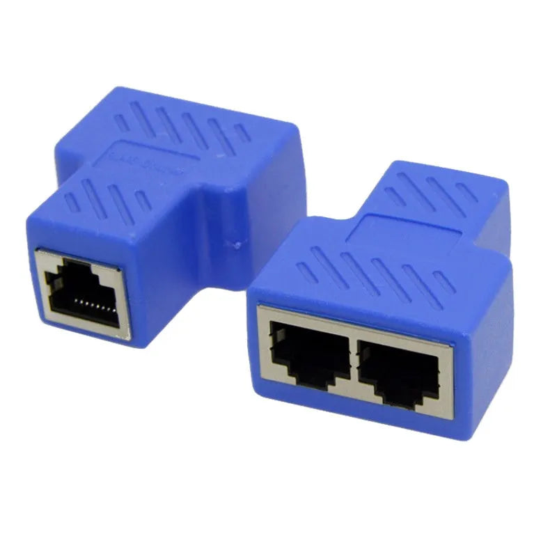 Two white RJ45 three-way tee network cable splitters on a surface