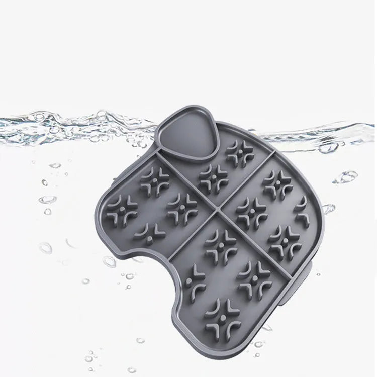 Gray silicone pet slow food pad with suction cups under a pet bowl