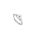 Adjustable antique-style copper ring with a round pearl inlaid in a geometric open frame on a twisted band.