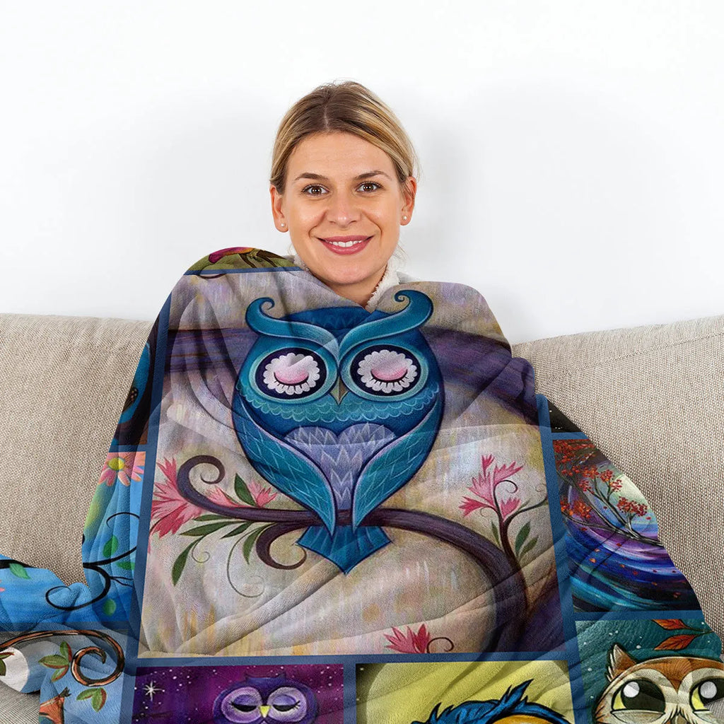 Flannel owl pattern soft fluffy multicoloured blanket in three sizes on a sofa setting