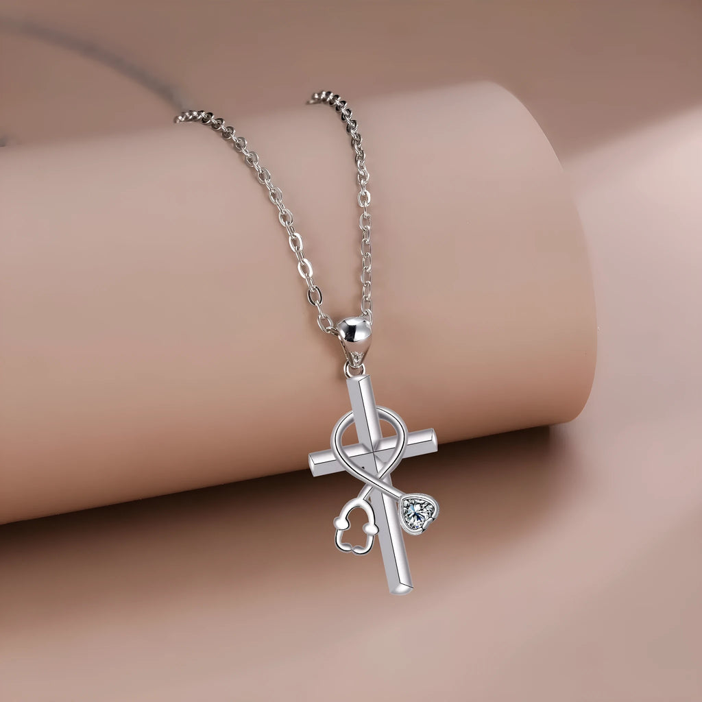 Copper cross stethoscope pendant necklace on a cross chain for women.
