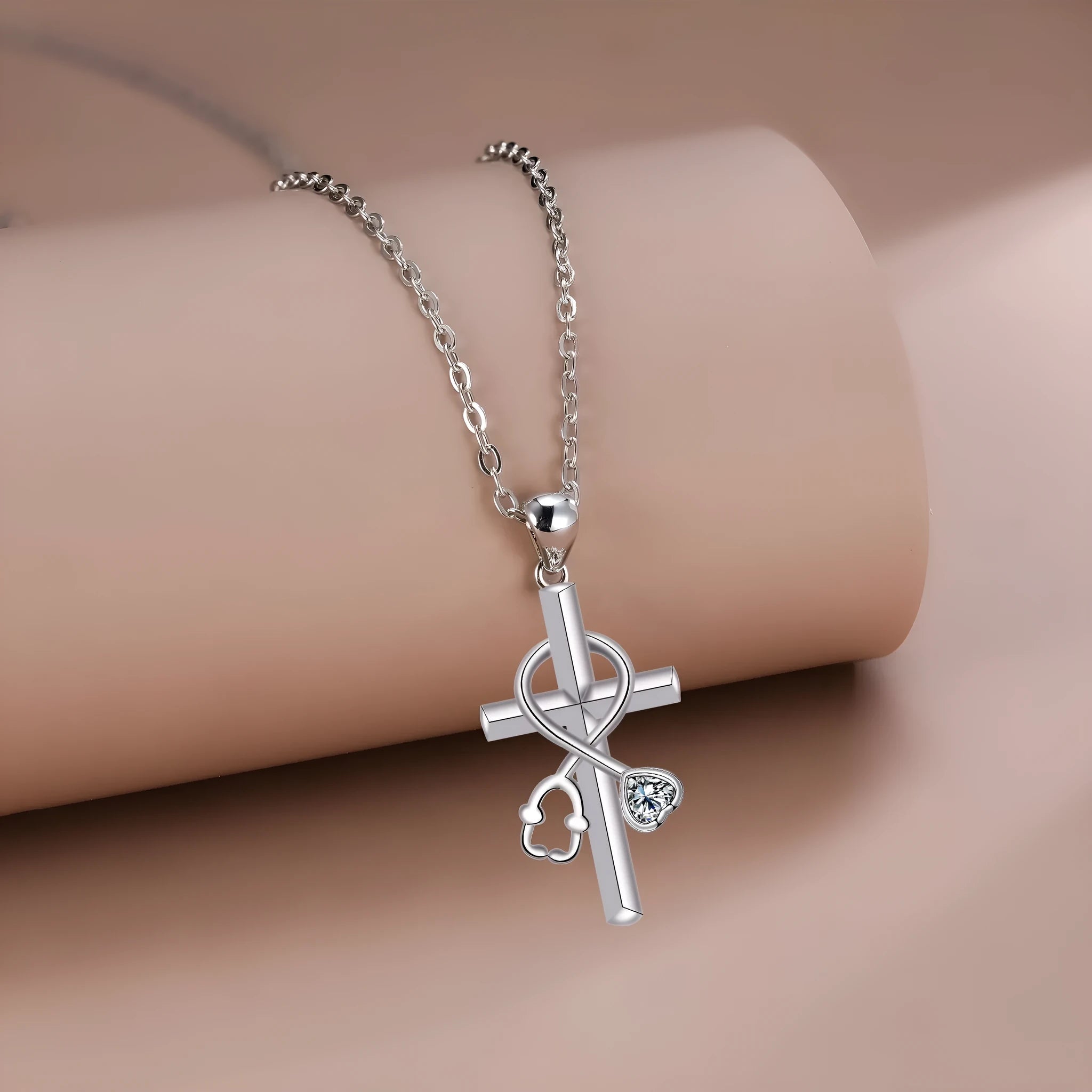 Copper cross stethoscope pendant necklace on a cross chain for women.