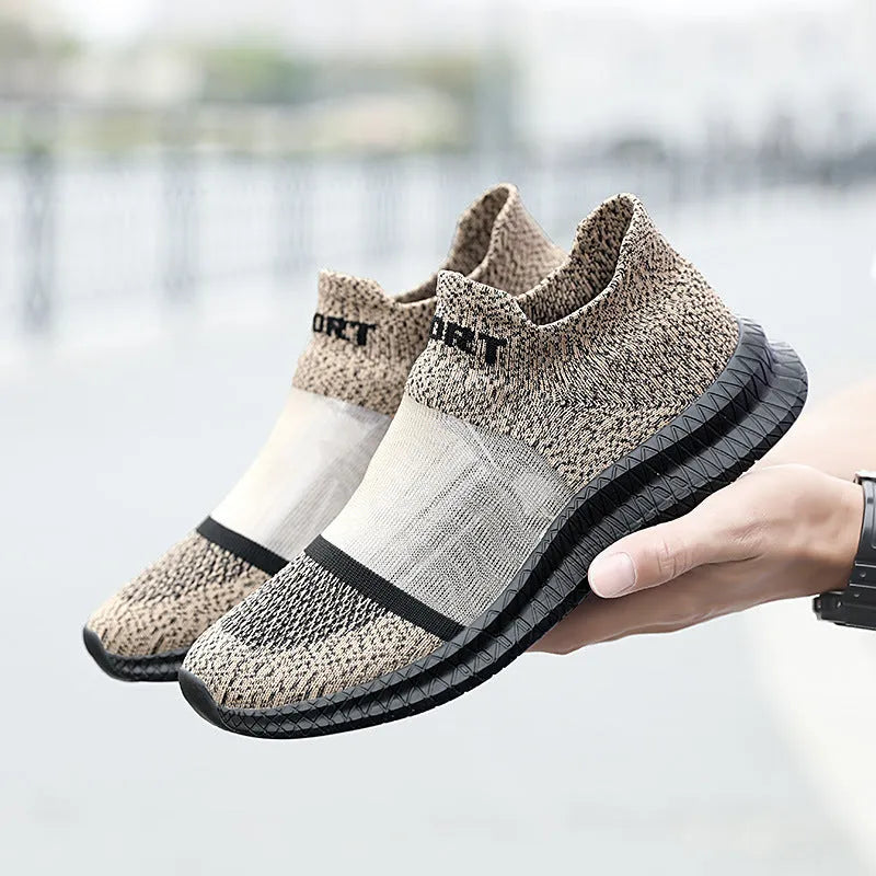 A pair of khaki Flyknit sock shoes with lace closure and a low-top design on an MD sole.