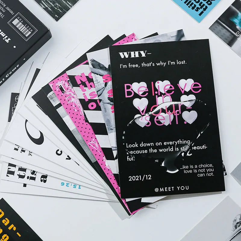 Box containing two creative postcard designs with the messages Time Not Arrived and Warm Wind Not Exhausted.