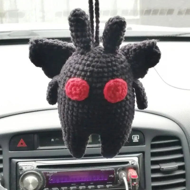 Plush hand-woven car hanging ornament in a cartoon design, made from soft polyester fabric.
