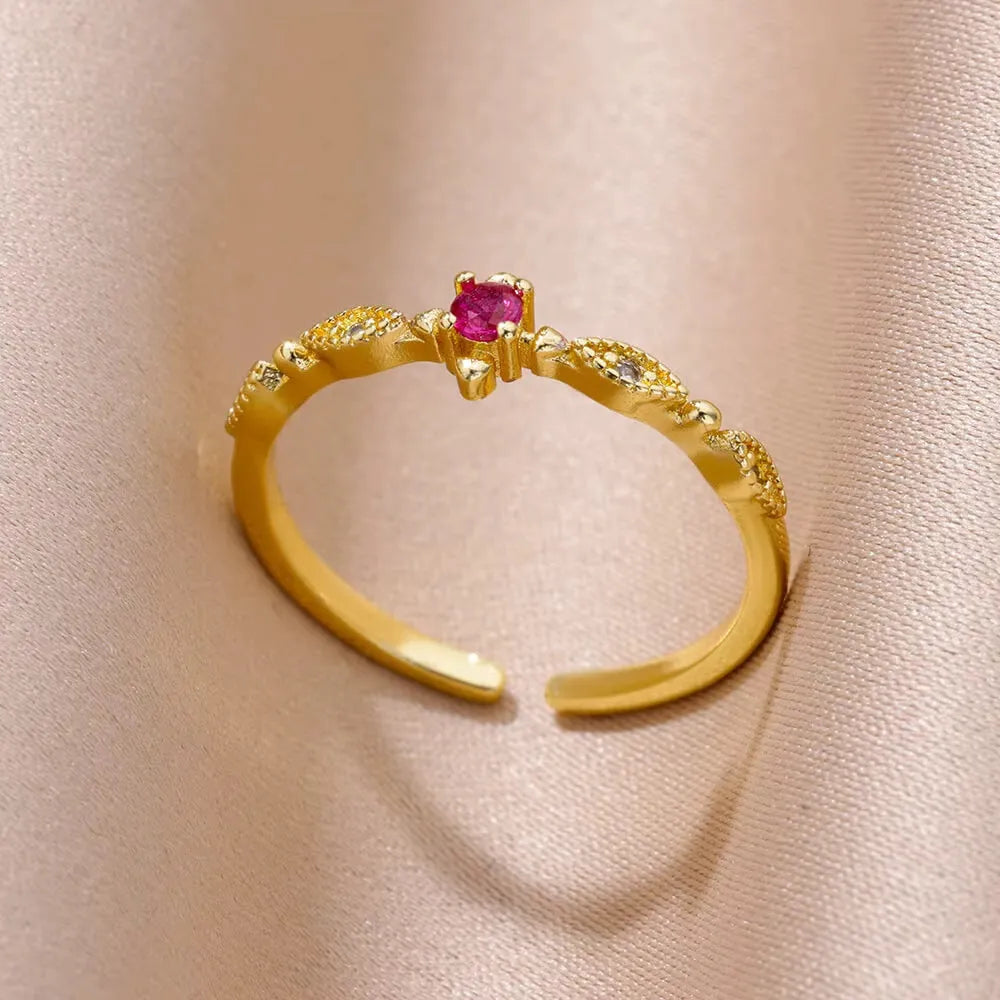 18K gold plated copper open mouth ring with synthetic zircon love emerald motif on white background