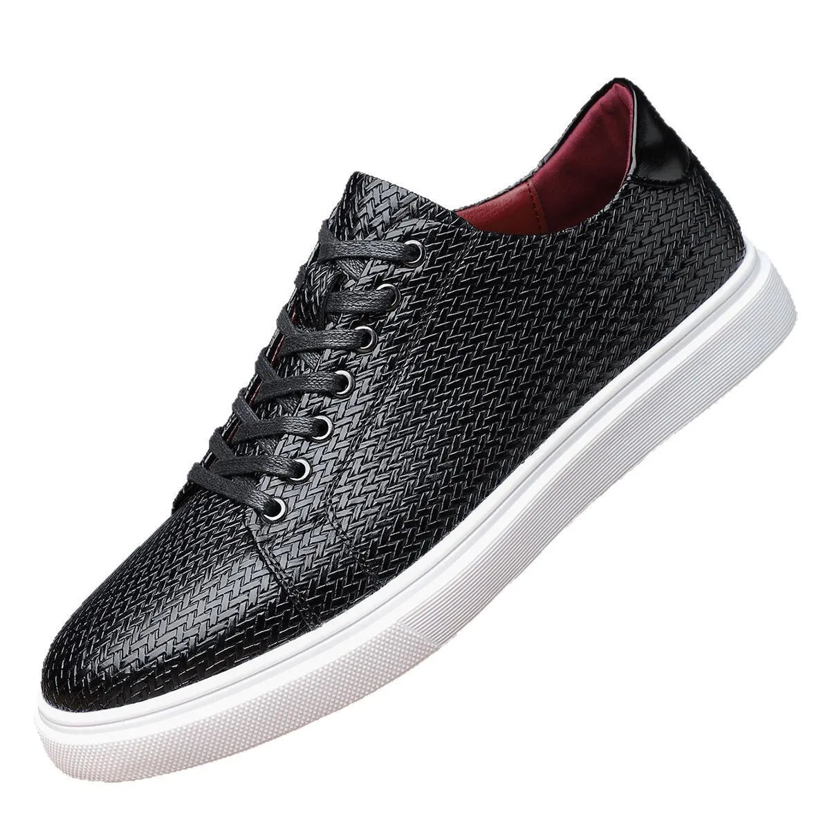 Men's low-top black leather-style shoes with decorative stitching and a rubber sole.