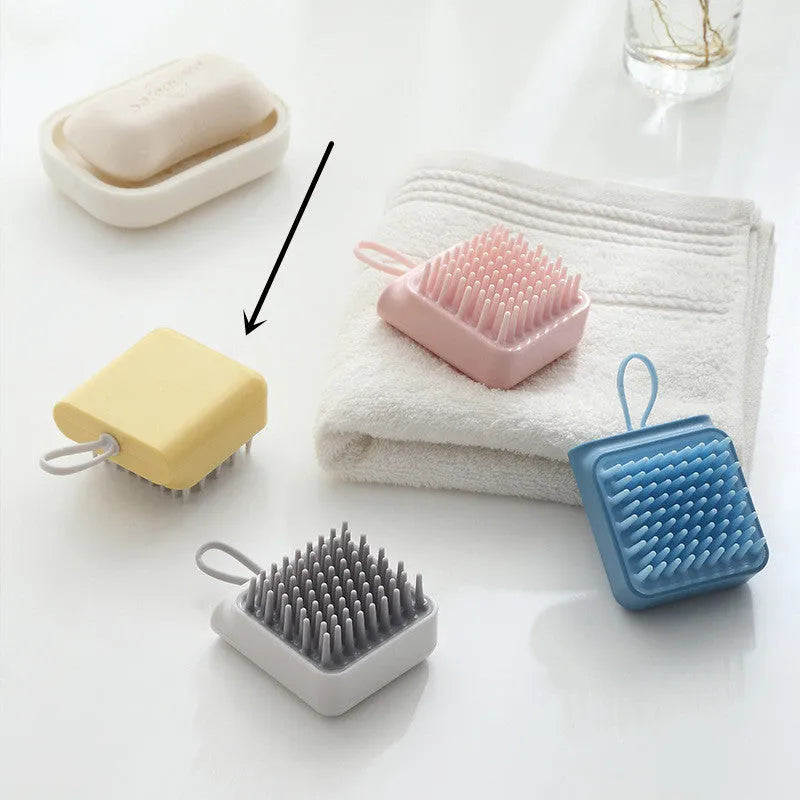 Pet bath brush with soft TPR combs for dog and cat grooming, available in blue, pink, white, and yellow.