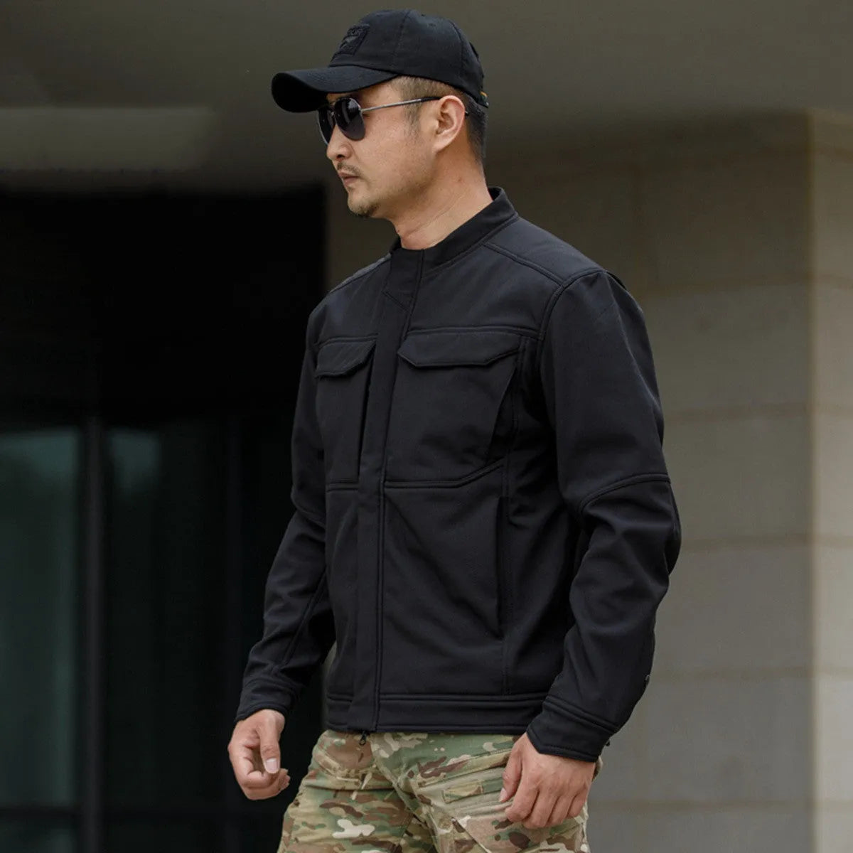 Bone Frog Peak Breaker soft shell tactical jacket in black camouflage for mountaineering.
