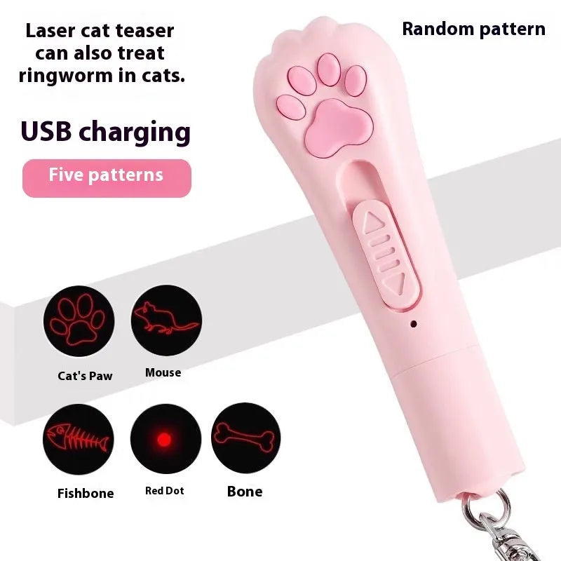 Pink automatic cat teaser toy with a wand attachment on a hardwood floor, showing compact circular base.