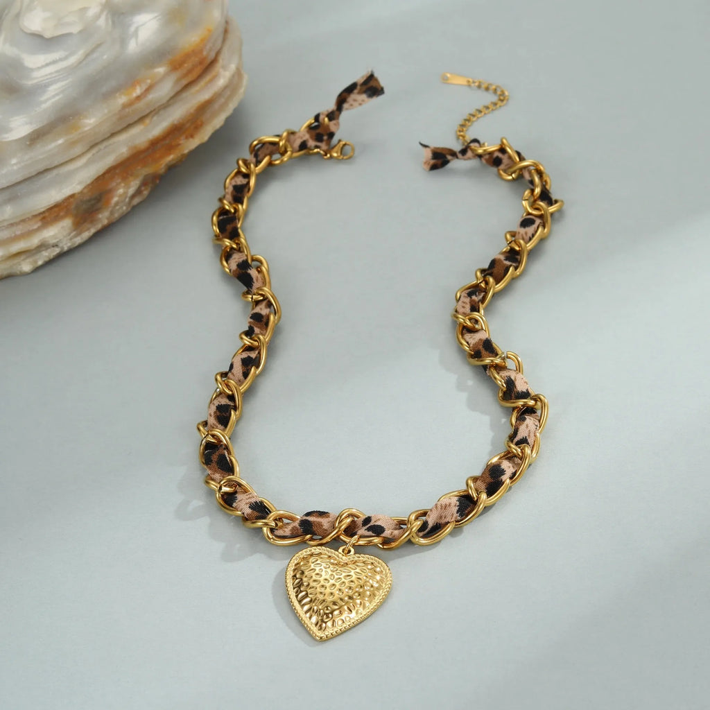 Leopard print geometric heart pendant on a stainless steel chain with adjustable length