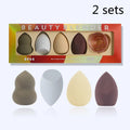 Four coloured hydrophilic polyurethane beauty eggs placed on a metal stand for makeup application