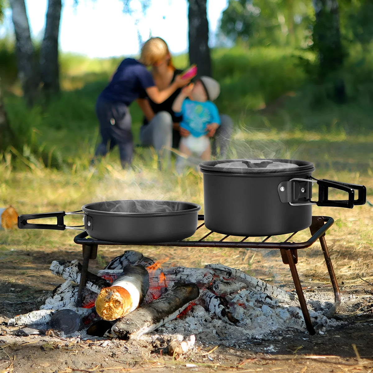 Camping cooker set with hard alumina pans, 0.8L teapot, stainless steel cups, plates, and cutlery in black, green, or orange.