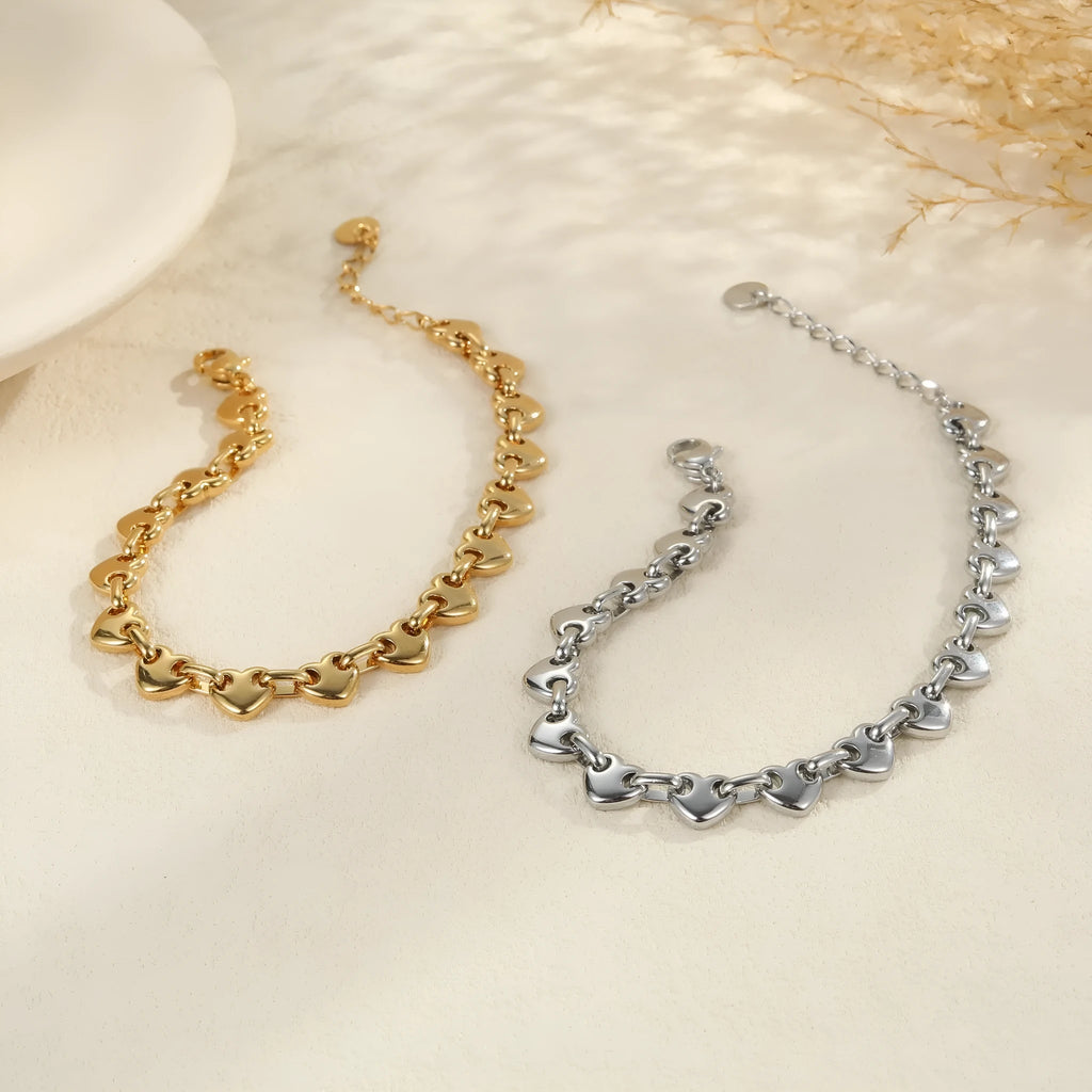 18K stainless steel hollow heart bracelet for women in gold, steel, or colour-blocked finish.