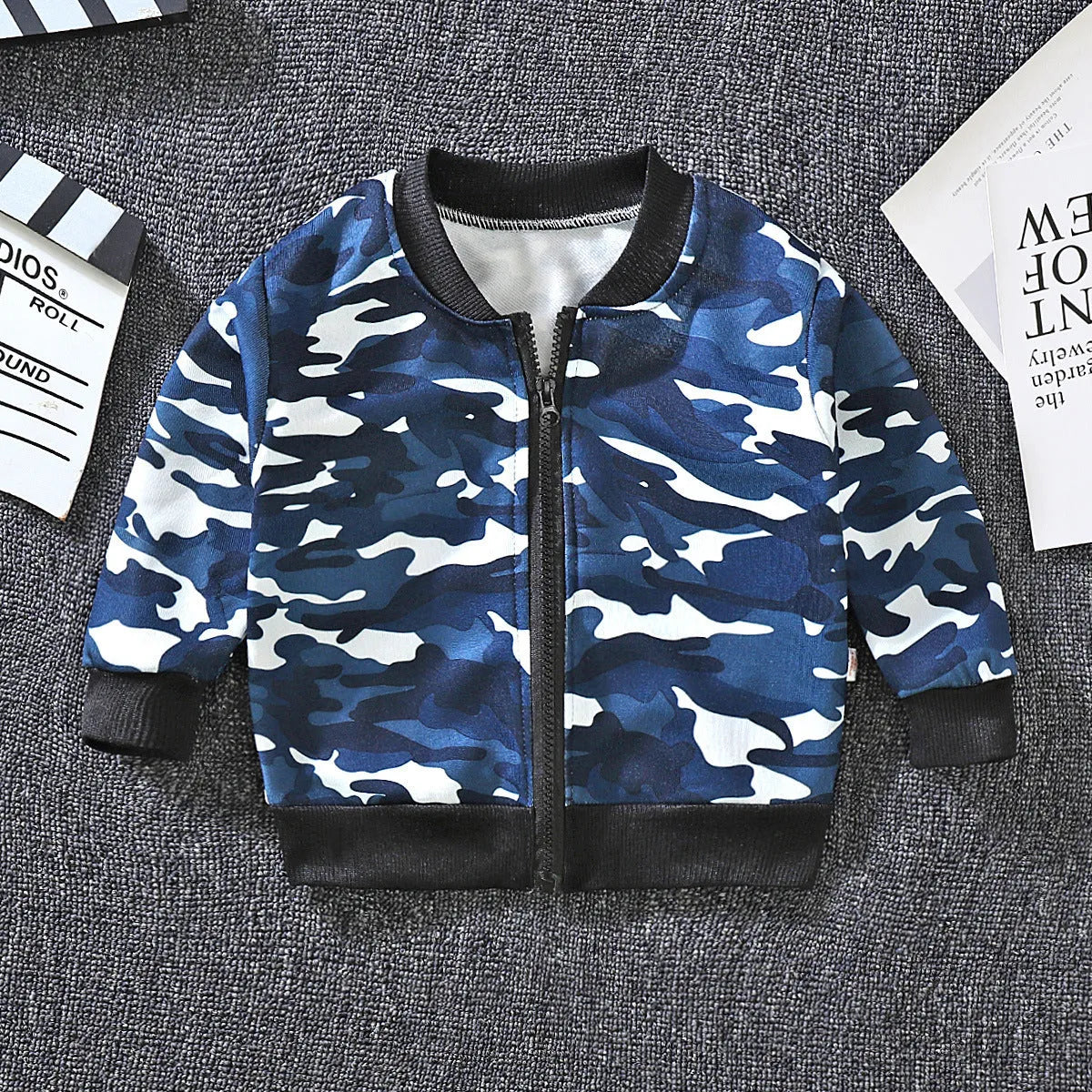 Boys and girls Korean baseball casual jacket with V-neck and cartoon prints in beige on white background