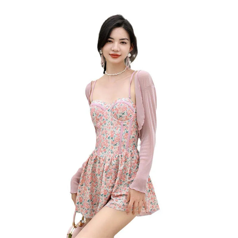 Women's floral pattern one-piece swimsuit with suspender straps in pink or green colour options