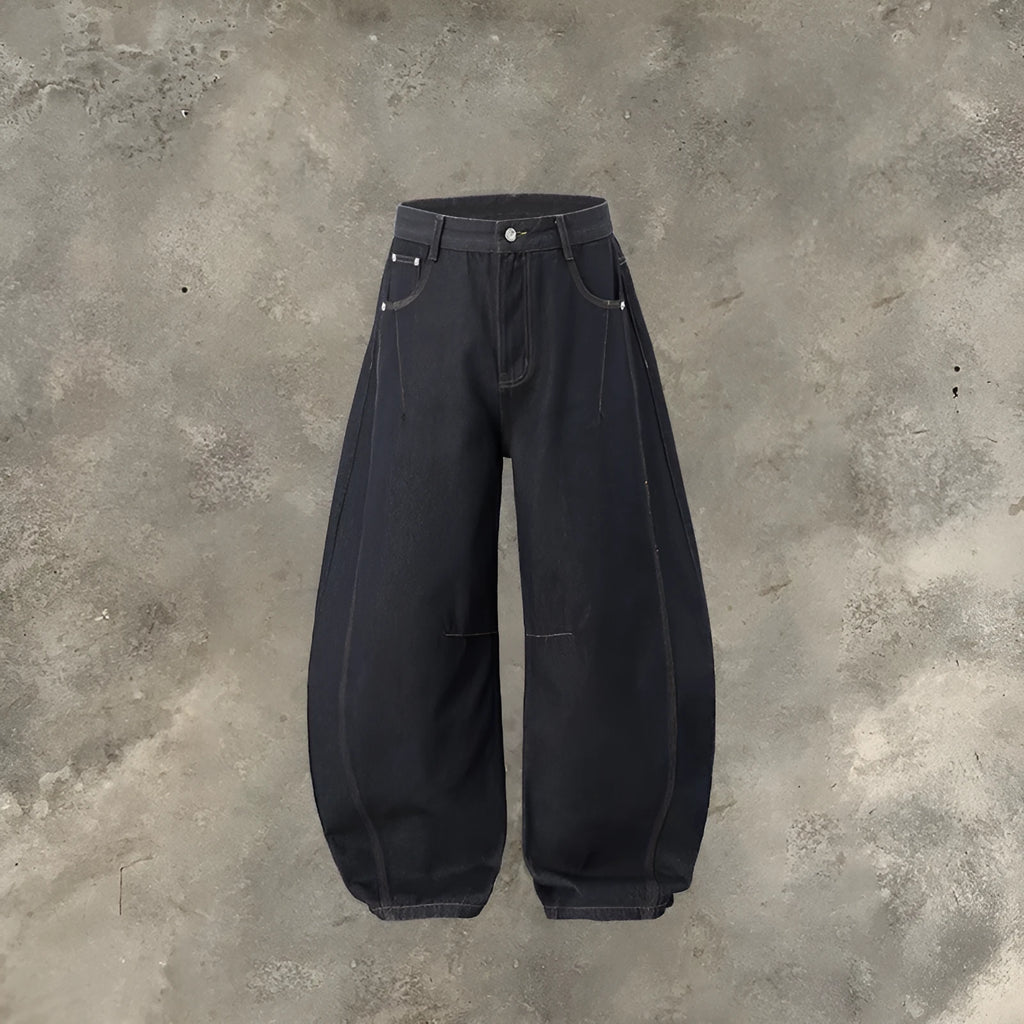 Men's original cow colour wide leg denim trousers laid flat.