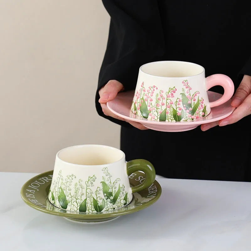 Ceramic coffee cup set with two 300ml cups, matching saucers, and stirring spoons