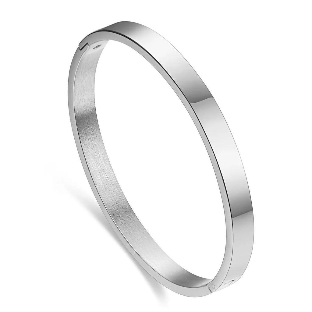 Stainless steel snap bracelet with polished finish in gold colour on a white background