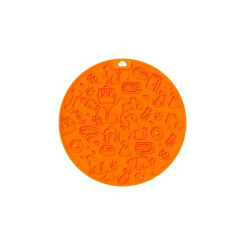 Round blue silicone pet licking mat with textured surface and white sucker on reverse.