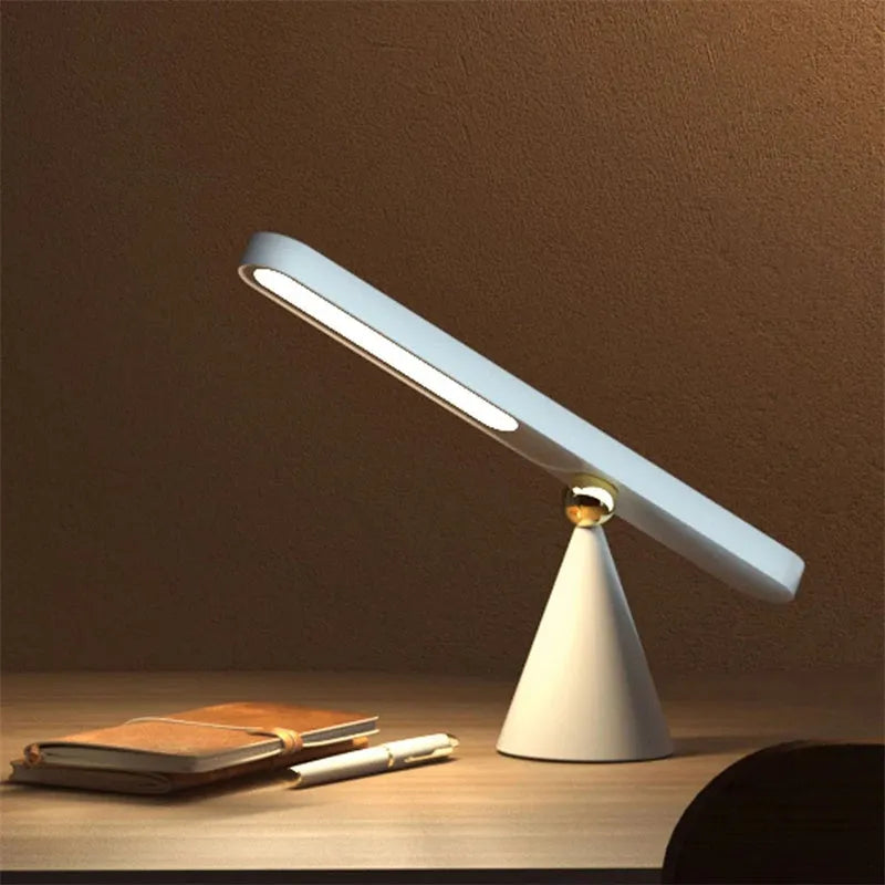 Creative geometric desk lamp in white with magnetic suction base and touch switch, USB powered