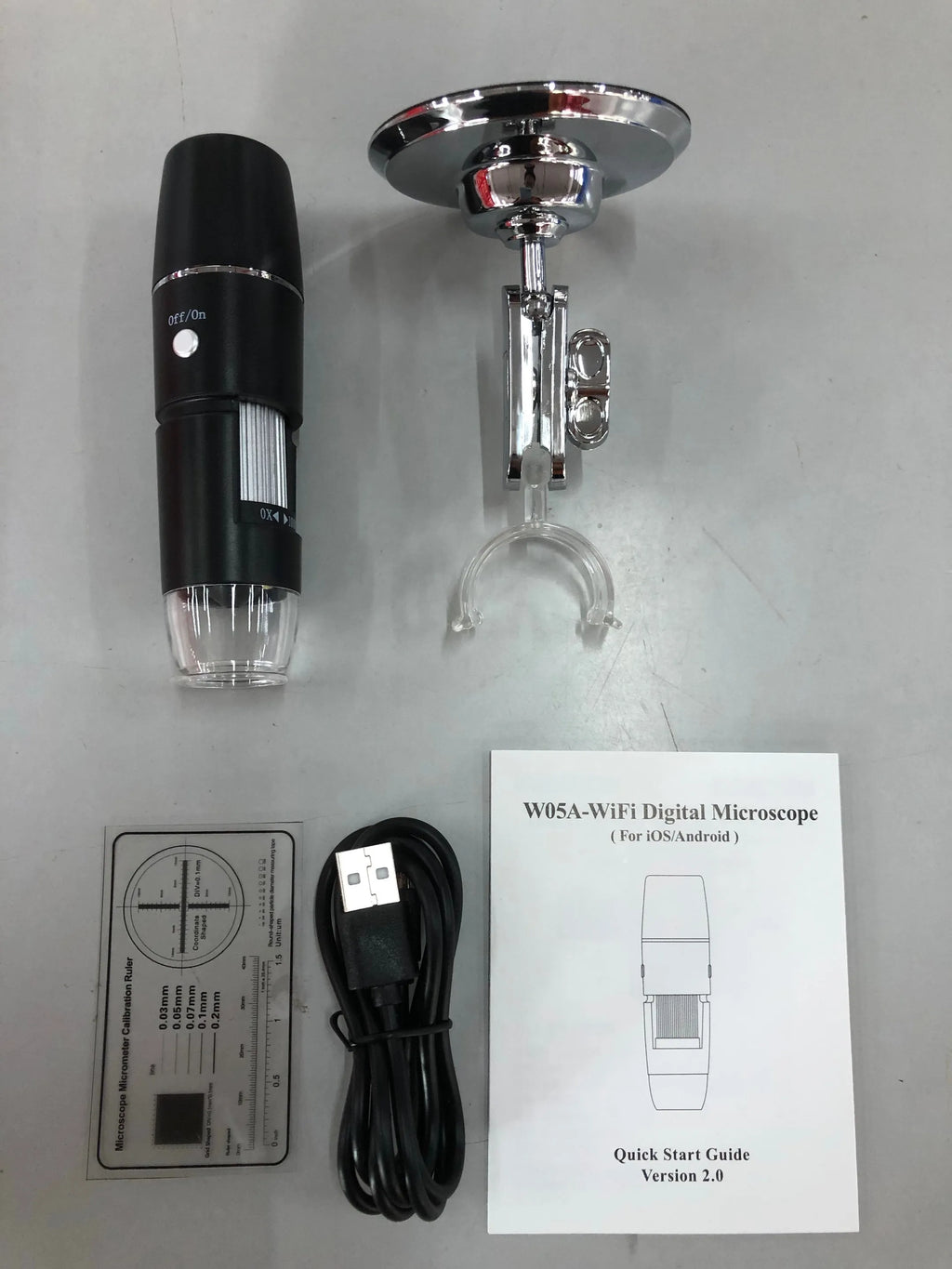 Black microscope magnifier camera phone bracket with 8 LED lights and 1.5m cable on a laboratory bench