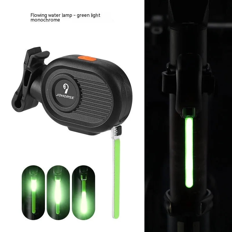 Bicycle rear safety light with cascading waterfall LED effect in blue, mounted on a bike seat post.
