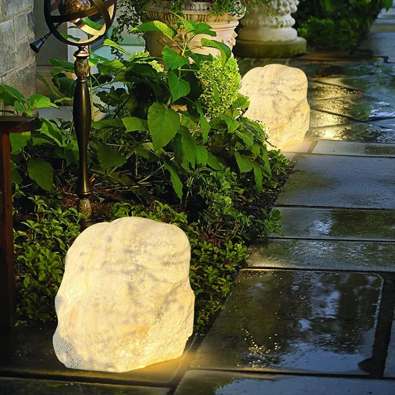 Outdoor waterproof stone resin floor lamp with warm light on garden pathway