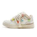 Creamy white women's retro lace-up skateboard shoes with low platform heel on rubber sole
