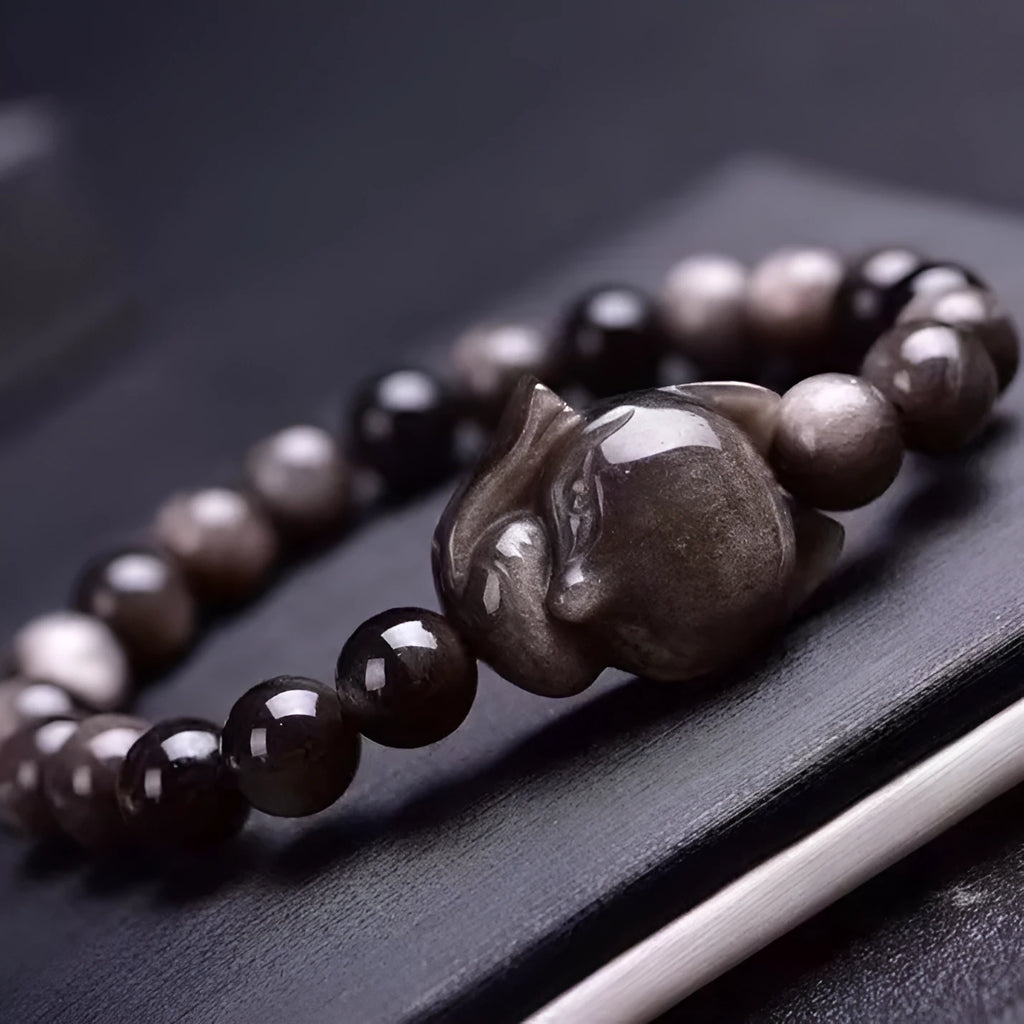 Obsidian Fox single ring bracelet with 8mm black stone bead and silver fox charm on adjustable band.