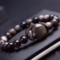 Obsidian Fox single ring bracelet with 8mm black stone bead and silver fox charm on adjustable band.
