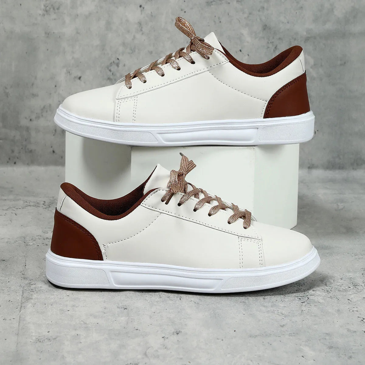Casual beige brown platform skateboard sneaker with cross strap detail and round toe