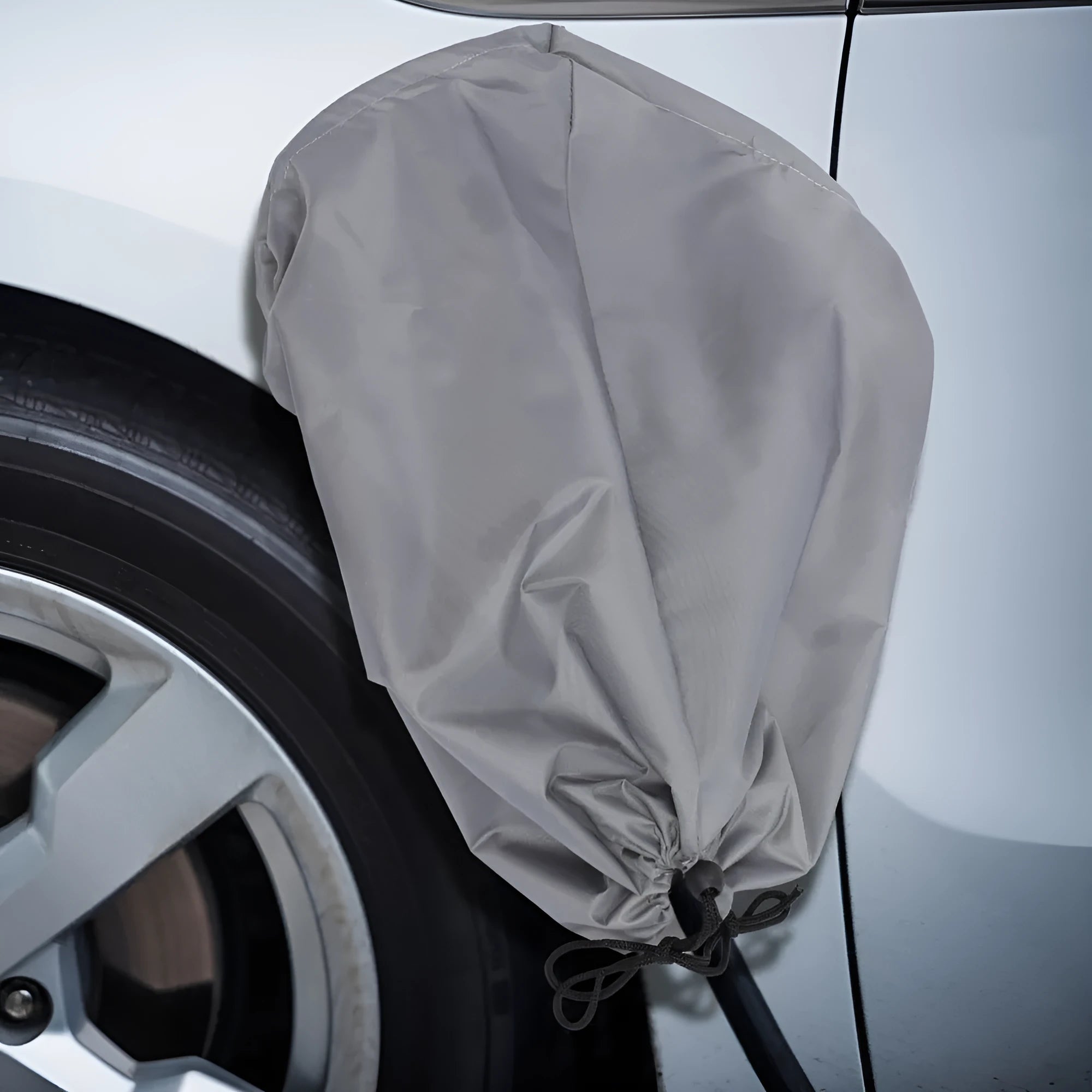Grey waterproof drawstring cover for electric vehicle charging port measuring 28x45x16cm