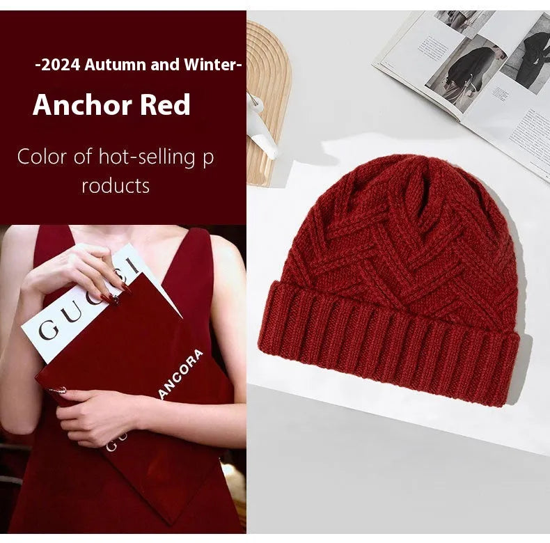 A woman's wool knitted winter hat in a dome crown style, shown in ankela red colour.