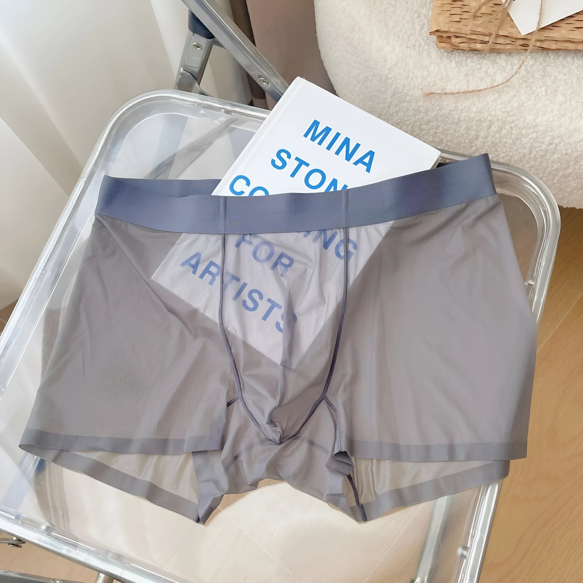 Men's thin seamless boxer shorts in quick-dry nylon fabric showing breathable construction and body shaping design